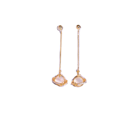 Gold planet dangling earrings